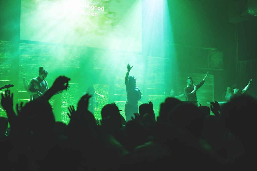 Dynamic church worship concert with a band performing on stage, creating a vibrant atmosphere.